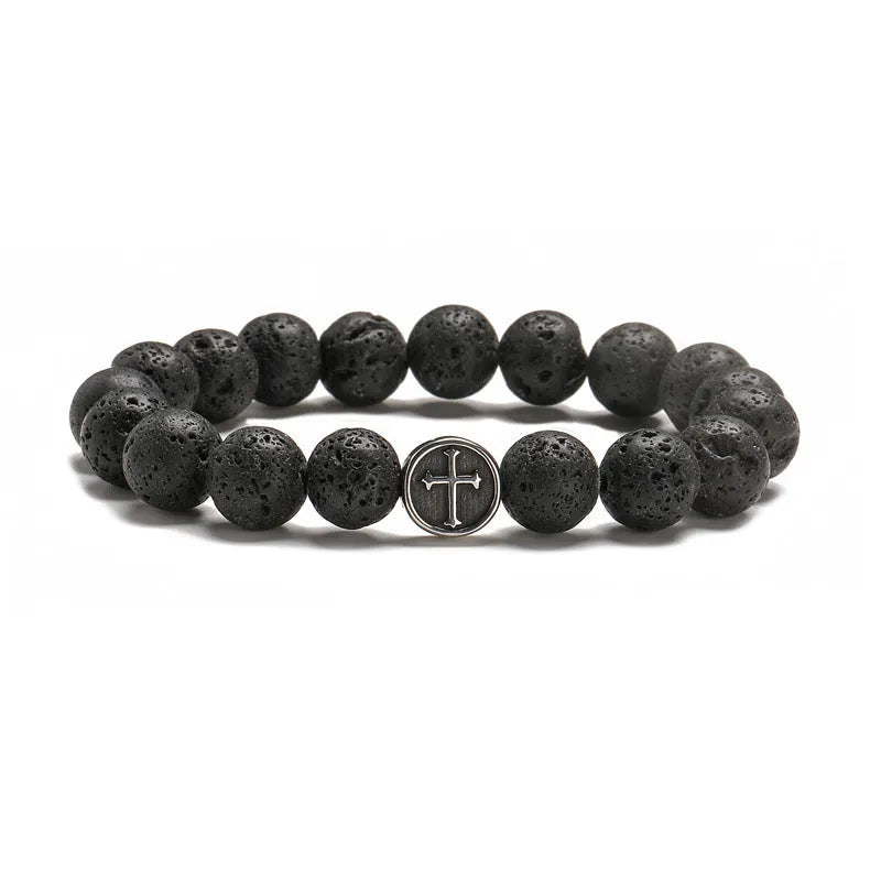 Close-up of a men's bracelet with black volcanic agate beads in a geometric shape on a stainless steel chain.