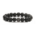 Close-up of a men's bracelet with black volcanic agate beads in a geometric shape on a stainless steel chain.