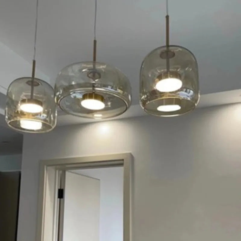 Single head glass pendant light with iron body, available in clear, cognac, amber, smoke grey, or coffee, adjustable height 1.5 m