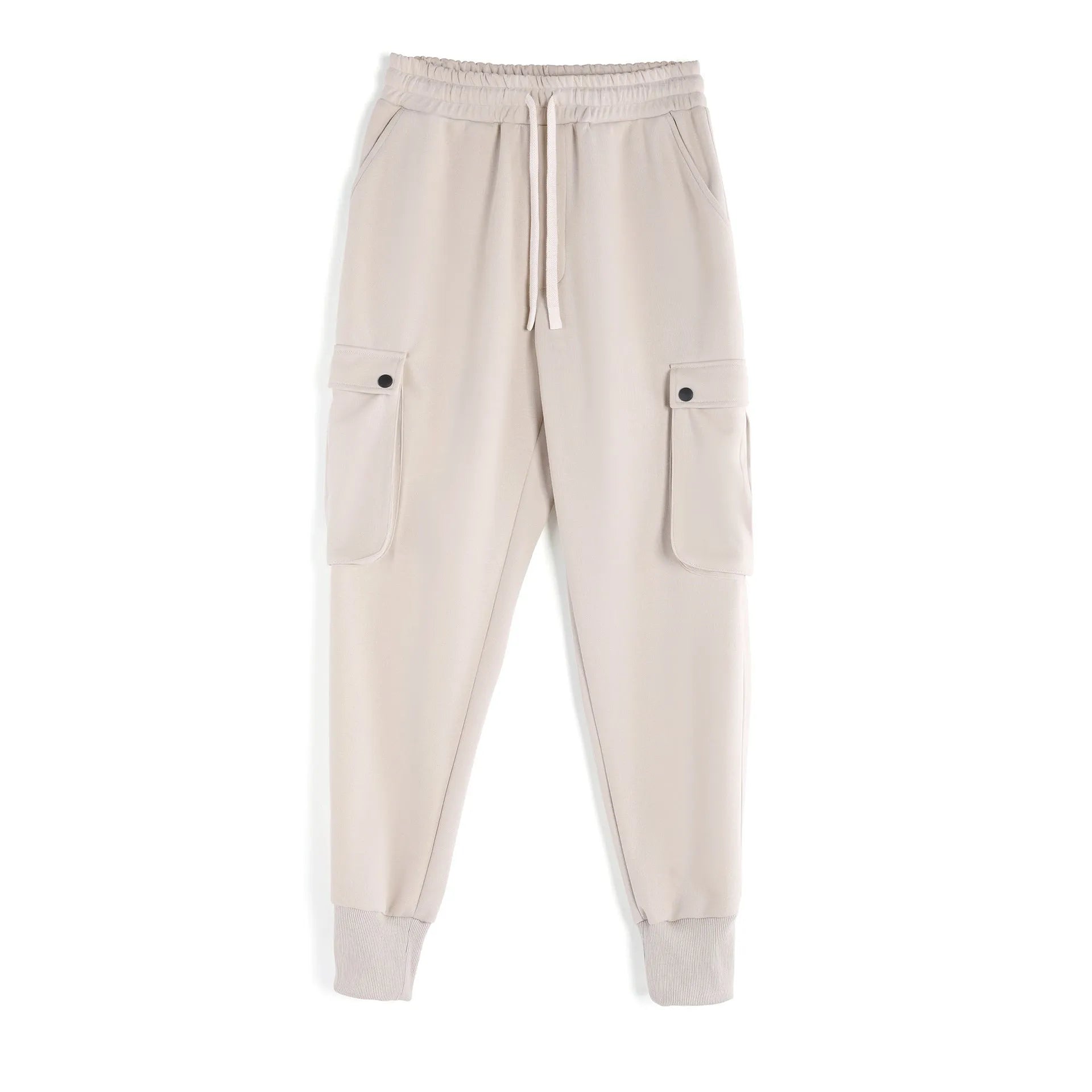 Men's loose-fit beige cotton trousers with tied ankle cuffs and multiple pockets on a neutral background.