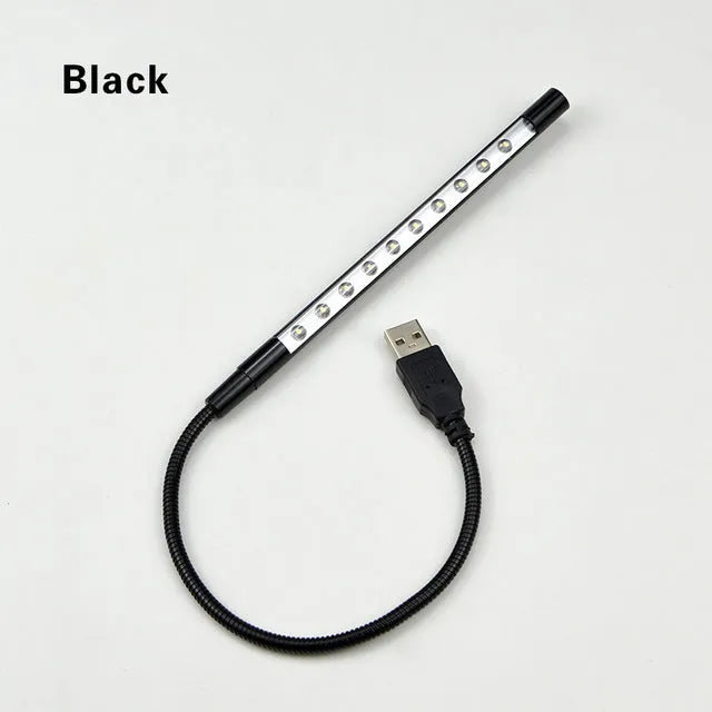 USB-powered spiral LED night light with aluminum alloy shade in black colour on desk