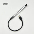 USB-powered spiral LED night light with aluminum alloy shade in black colour on desk