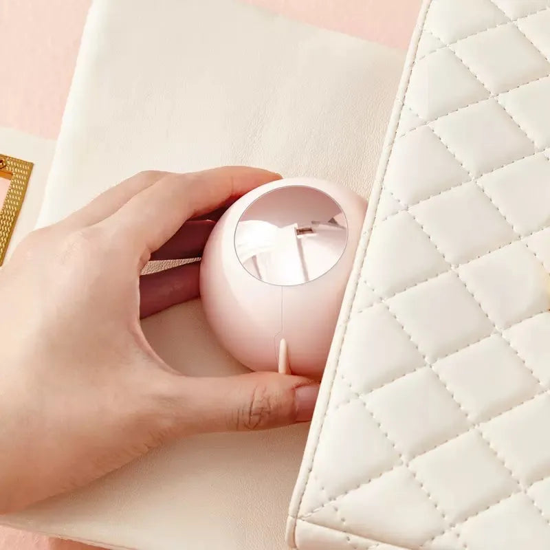 Reusable ABS hair removal ball lint roller in pink, showing handle and sticky roller surface.