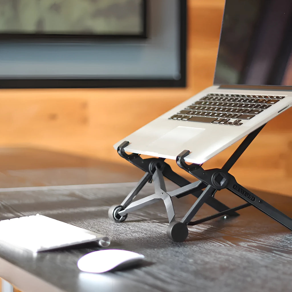 Black foldable enhanced nylon laptop stand shown open next to its portable carry bag.
