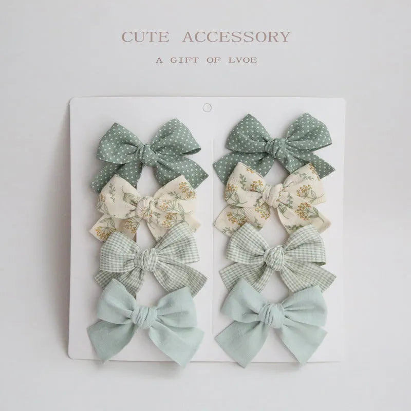 Dovetail bow hairclip set for children in cloth material with eight colour options