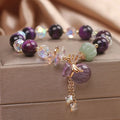 Women's purple tigereye crystal bracelet with money bag pendant and rhinestone decoration in forest style design