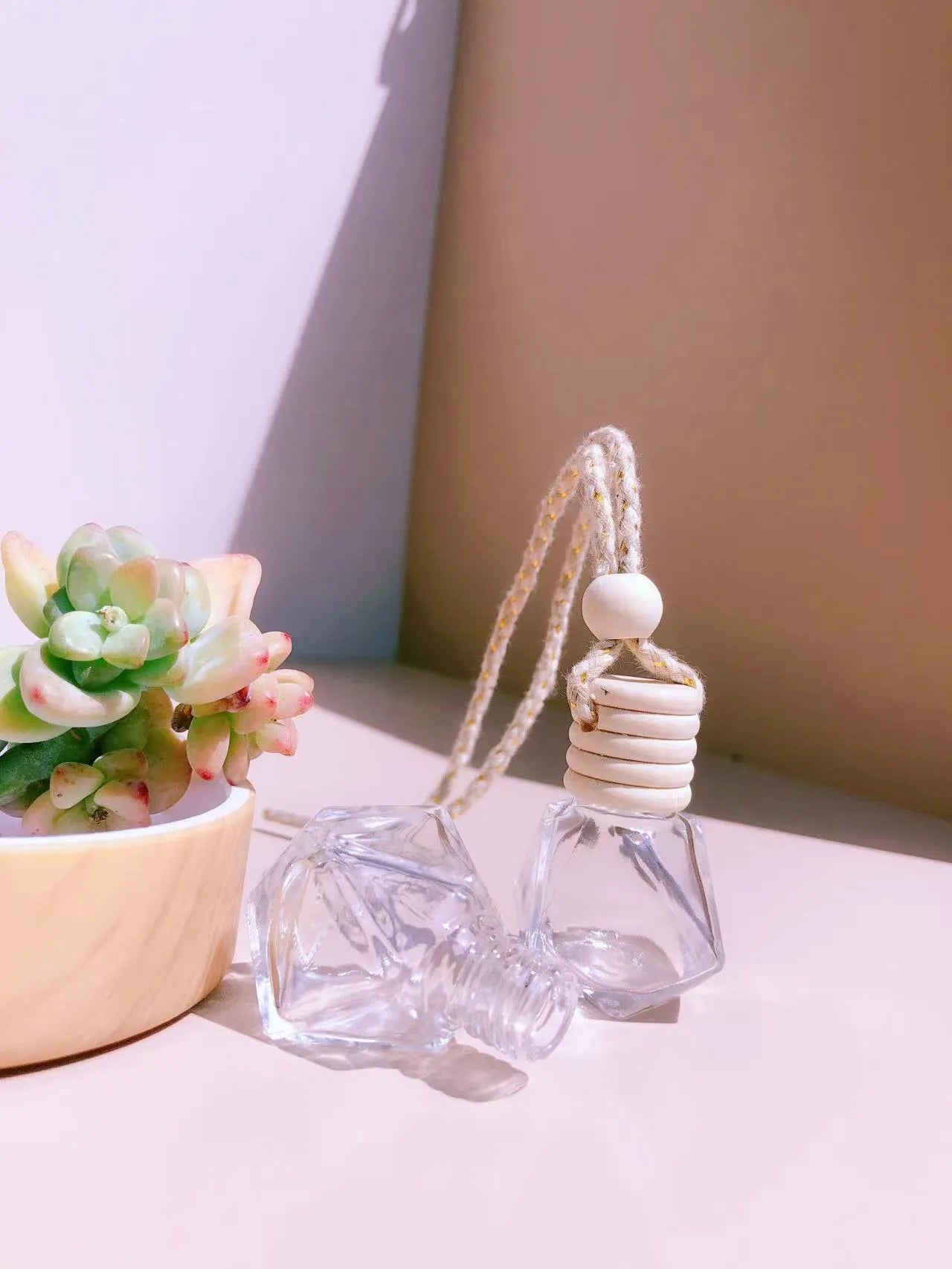 Glass car fragrance pendant showing Cylinder, Diamond, Flat Drum, and Square bottle style options.