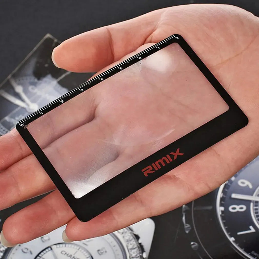 Portable credit card sized plastic magnifier in Black and White colour options.
