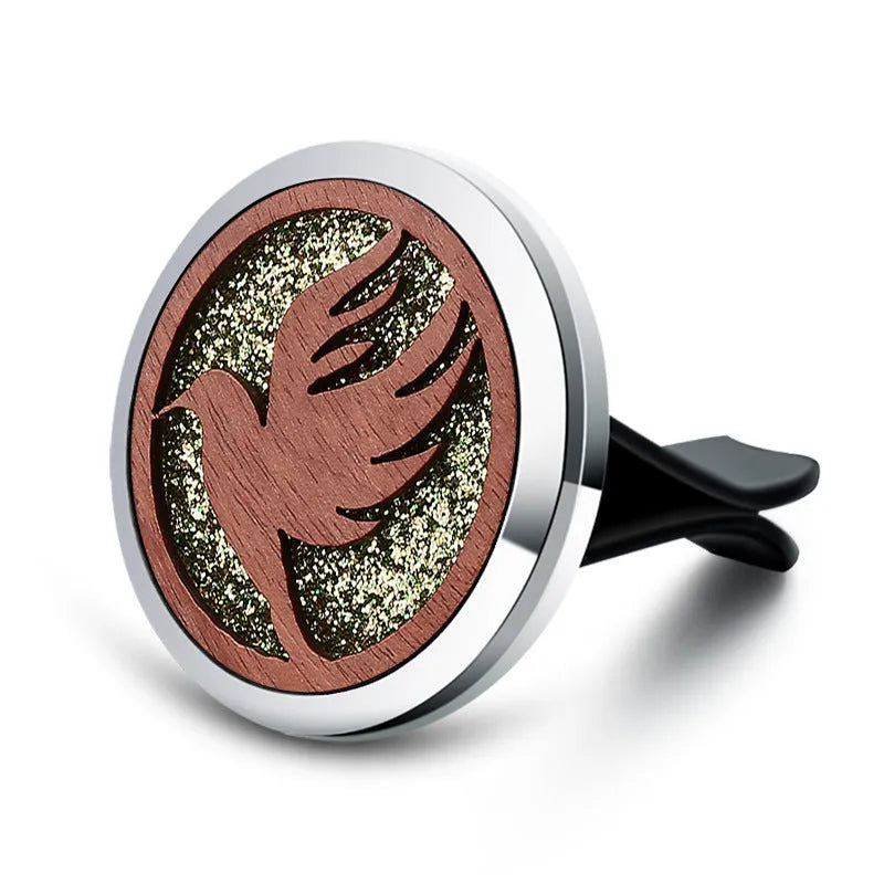 Round car vent aromatherapy clip in alloy wood construction showing hollow centre for incense