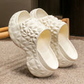 Women's khaki high heel Eva flip flop slippers with a thick sole on a white background.