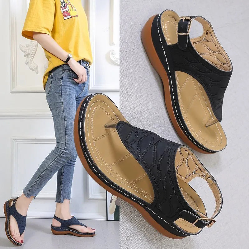 Women's wedge heel casual sandals in red with an adjustable back strap and flip-flop style.