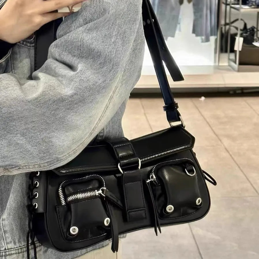 Black PU messenger bag with adjustable crossbody strap showing internal zipper change compartment