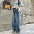 A woman wearing high-waist straight leg jeans in a retro blue colour, showcasing the classic denim fit.