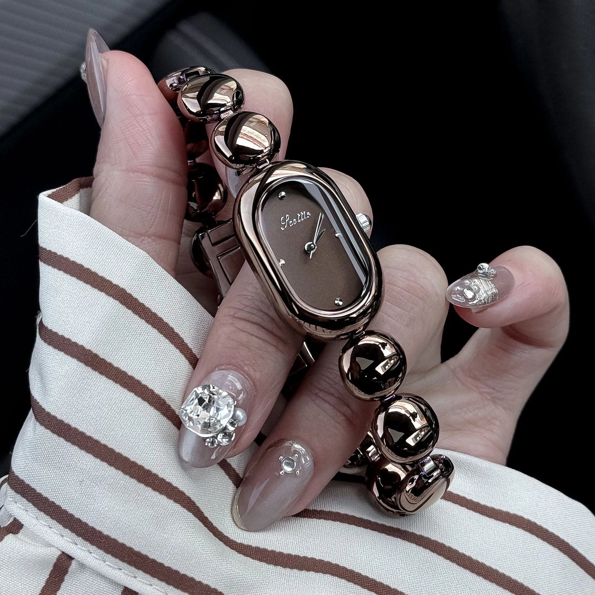 Women's oval fashion watch with slim profile in gold and colour variations