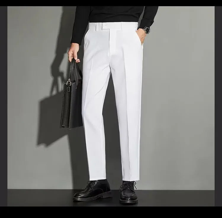Men's straight-leg ankle-length suit trousers in a light colour, showing the spring draping effect on the leg.