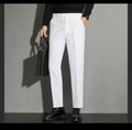 Men's straight-leg ankle-length suit trousers in a light colour, showing the spring draping effect on the leg.