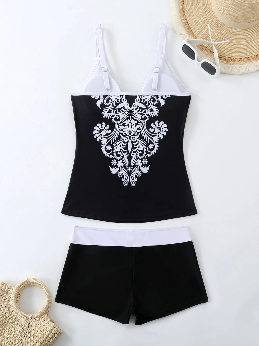 Plus size women's printed two-piece swimsuit in black or rose red with brief bottoms.