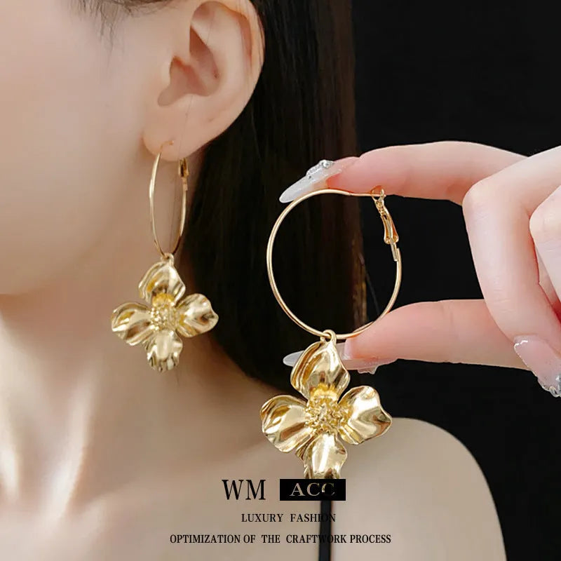 Silver Needle Metal Flower Earrings showing geometric floral pendant on long needle post in gold or silver.