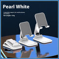 Foldable universal phone holder in black or white for bedside and desktop use