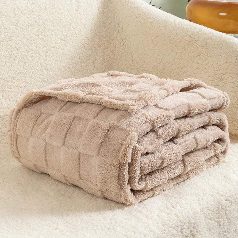 Geometric pattern polyester blanket in cream colour showing textured design and thickened construction