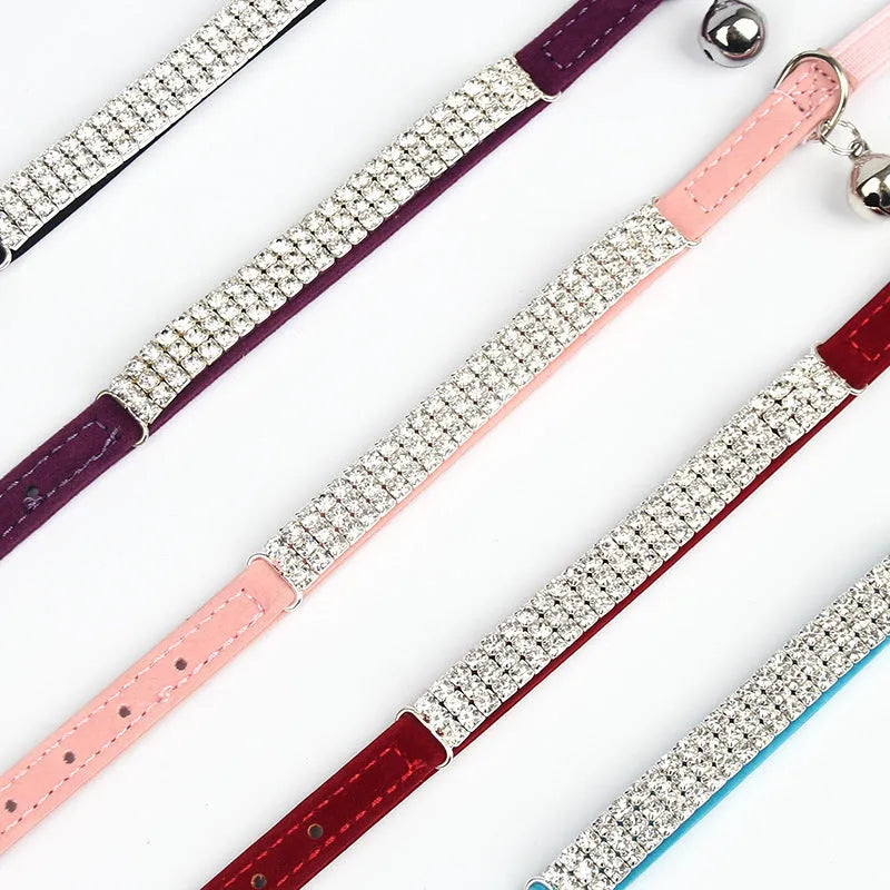 Velvet cat collar with rhinestones in red, blue, purple, black, or pink, showing adjustable buckle.