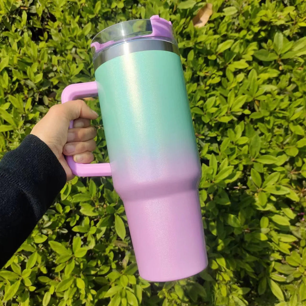 Large stainless steel vacuum insulation cup showing rainbow colour options and gradient designs