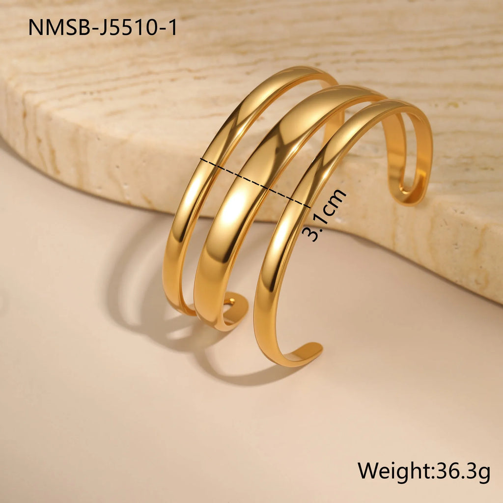 Women's stainless steel bracelet with geometric design and simple opening mechanism in gold electroplated finish