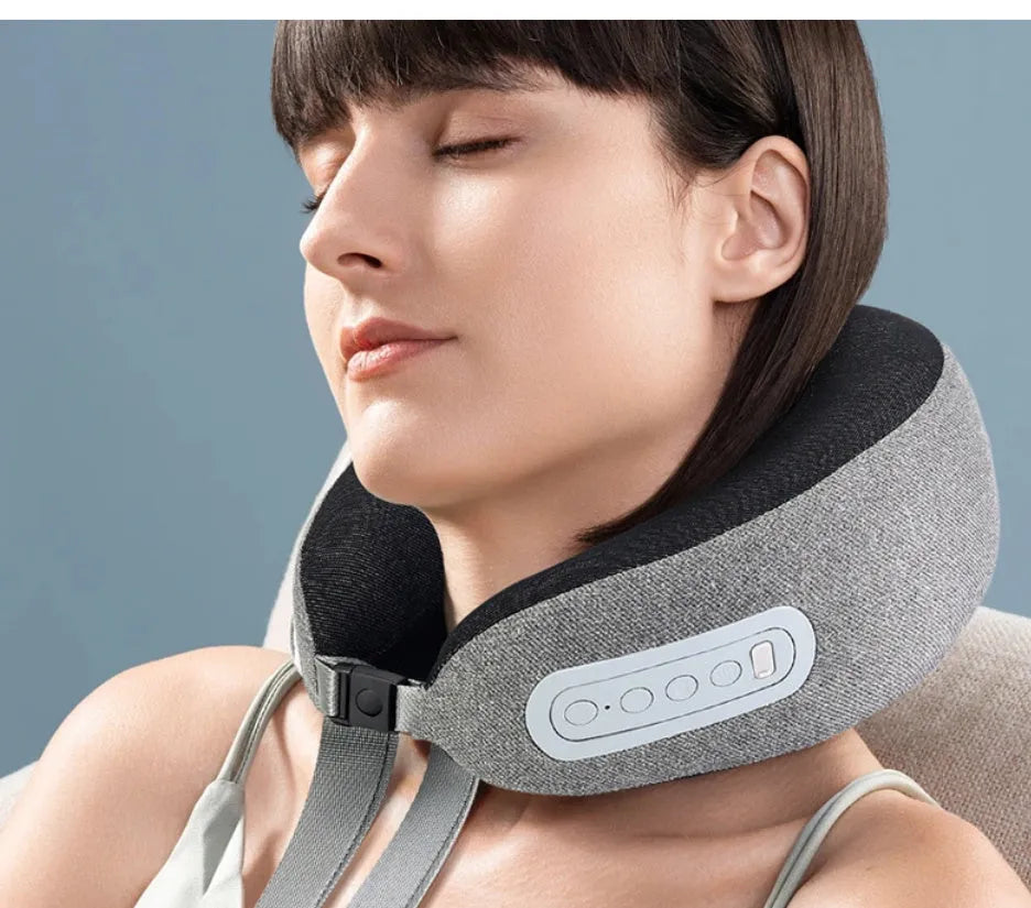 Light grey U-shaped memory foam massage pillow with USB cable on a neutral background