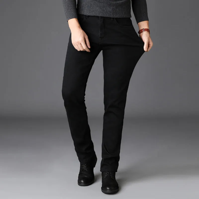 Men's slim straight leg jeans in black cotton denim with mid waist and zip fly, sizes 28-40.