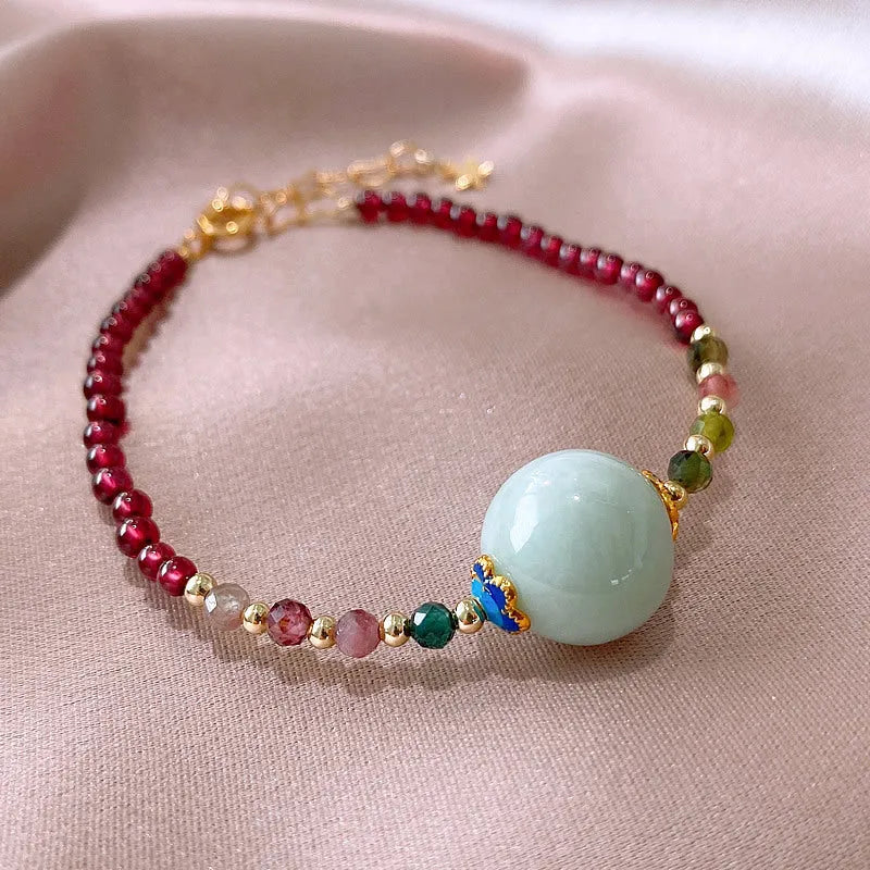 Simple aquamarine garnet bracelet with drop-shaped tourmaline stones and electroplated metal components
