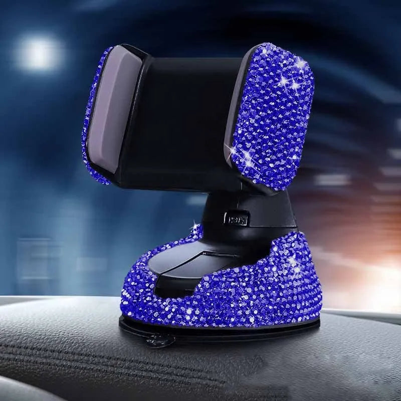 Diamond-encrusted car phone holder mounted on air vent with adjustable push-button mechanism and smartphone securely held