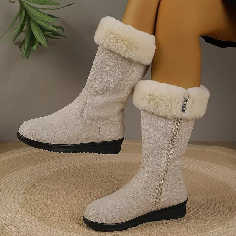 Fleece-lined mid-calf snow boots in black with waterproof platform sole and round toe, on a white background