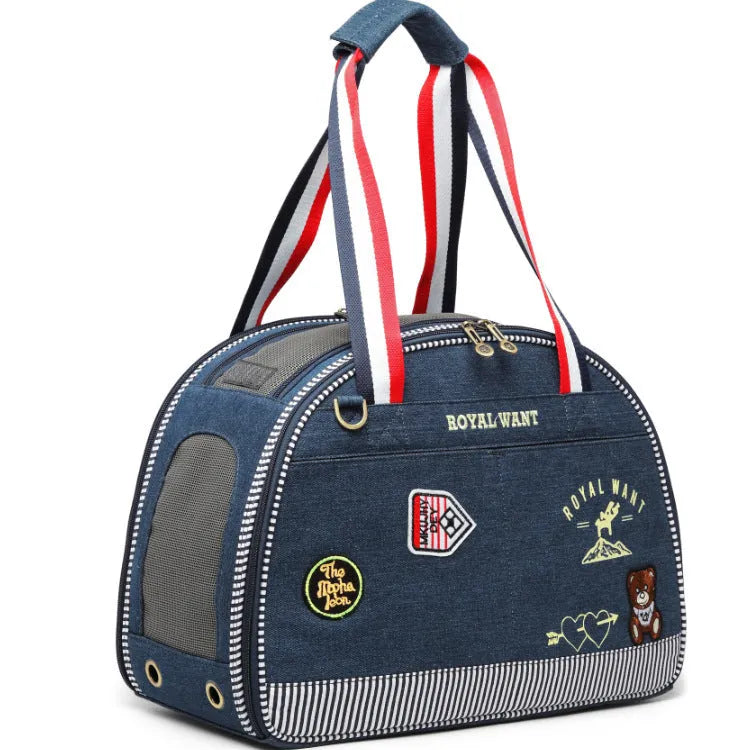 Blue denim Japanese-style pet carrier bag with cartoon pattern, dimensions 43x20x30cm.
