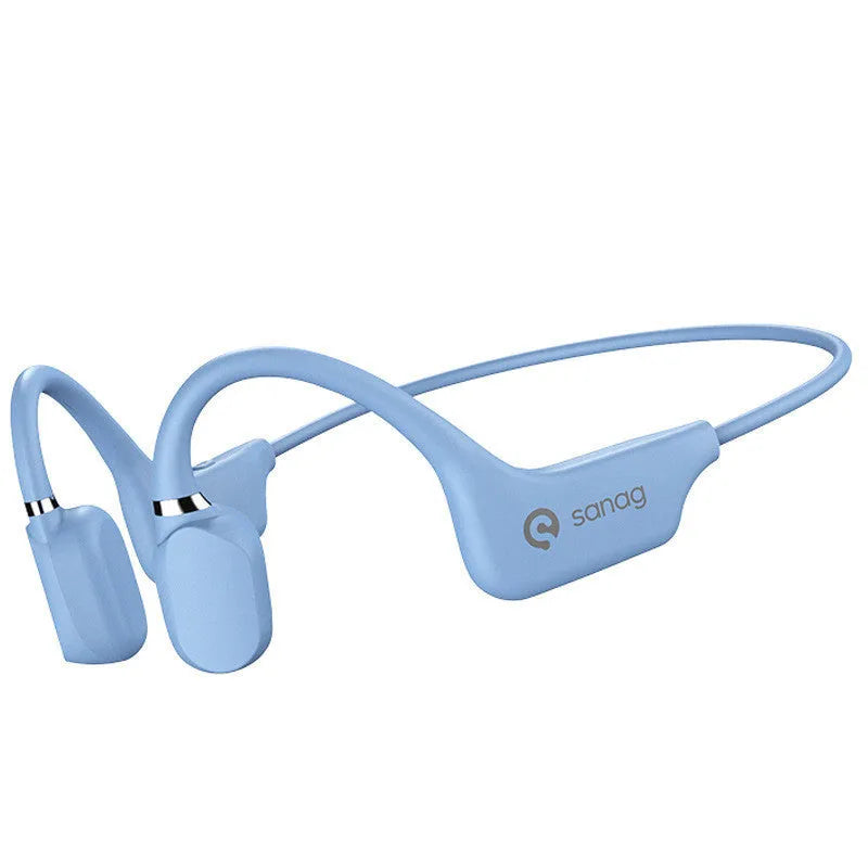 A person wearing black bone conduction Bluetooth headphones around their neck during a run.