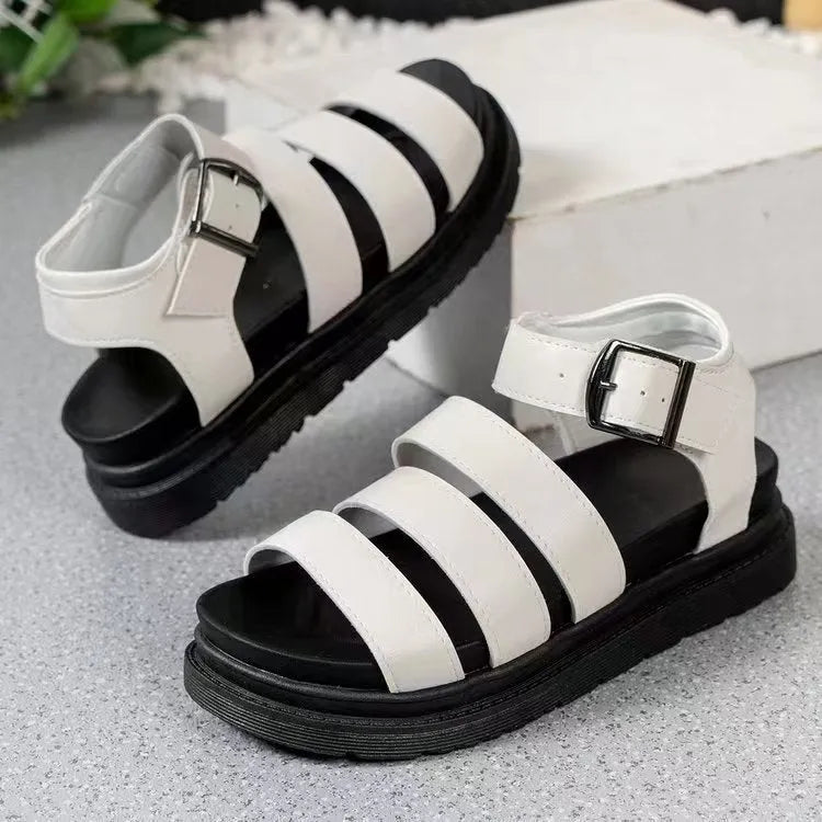 Black thick-soled beach sandals with an adjustable buckle strap and round toe fish mouth design.