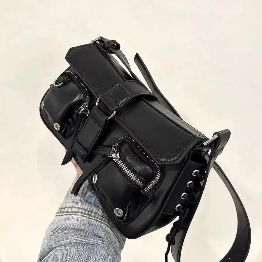 Black PU messenger bag with adjustable crossbody strap showing internal zipper change compartment