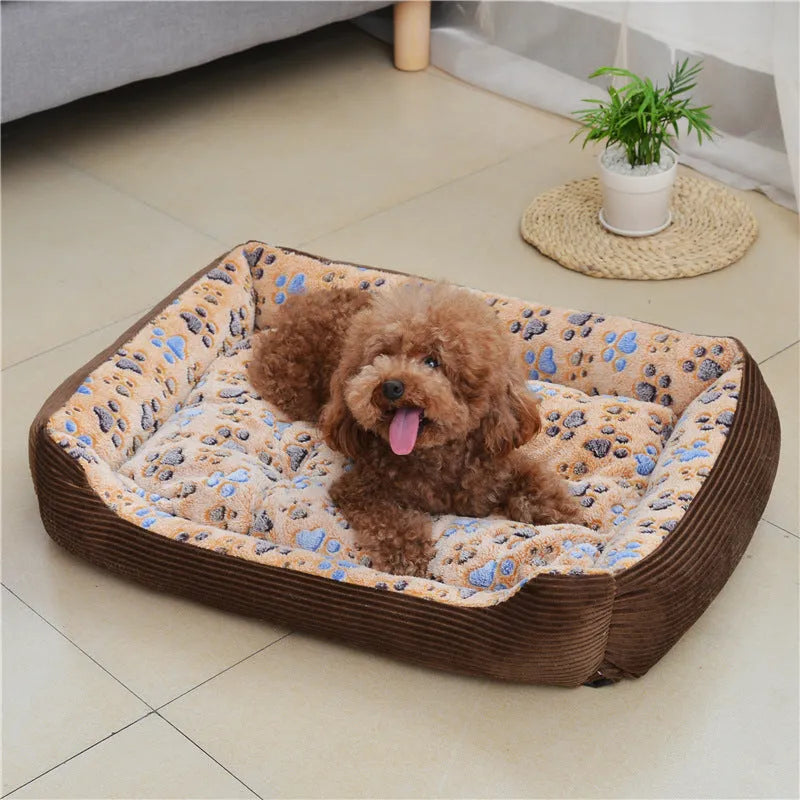Beige sofa-style dog bed with plush fabric and raised bolsters for small dogs
