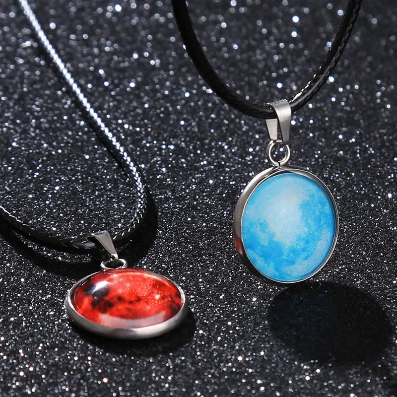 Close-up of a luminous alloy necklace with a glass pendant featuring a Christmas moon night sky and constellation design.