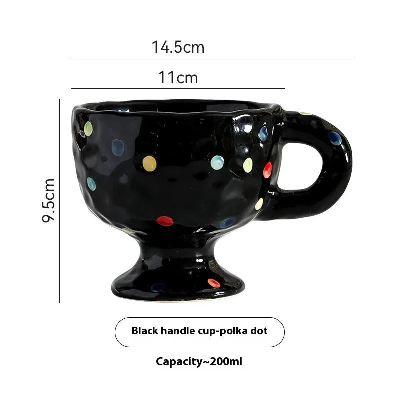 Handmade irregular solid colour ceramic mug on a table