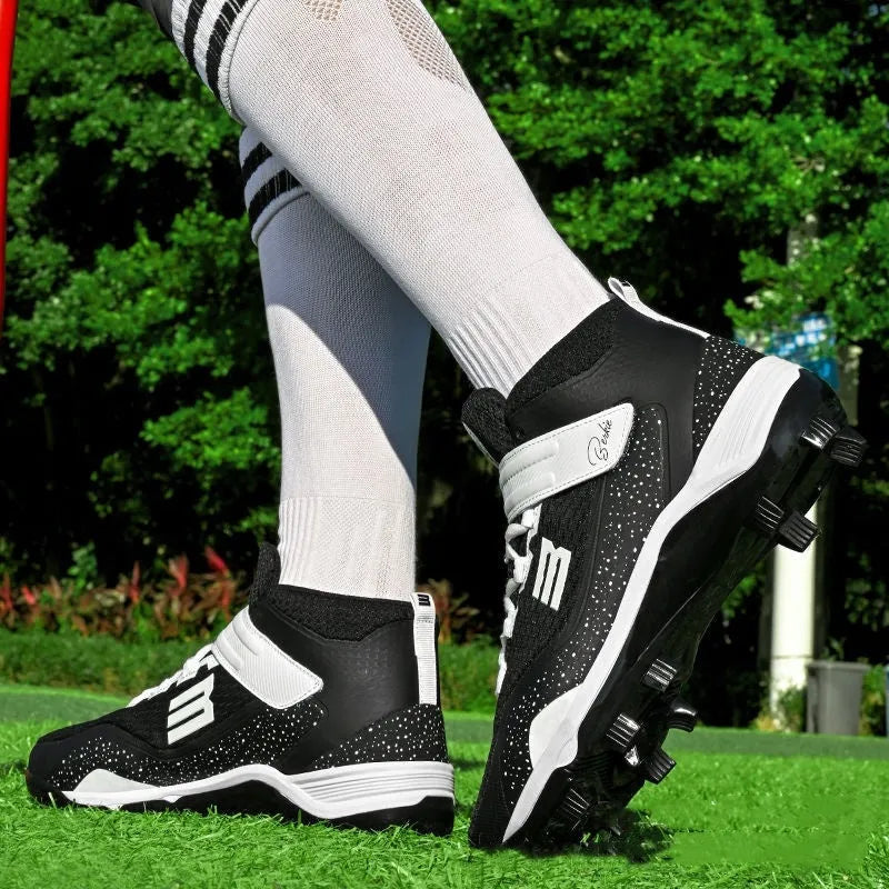 Black and white middle-top training sneakers with Velcro closure and wear-resistant rubber soles for softball