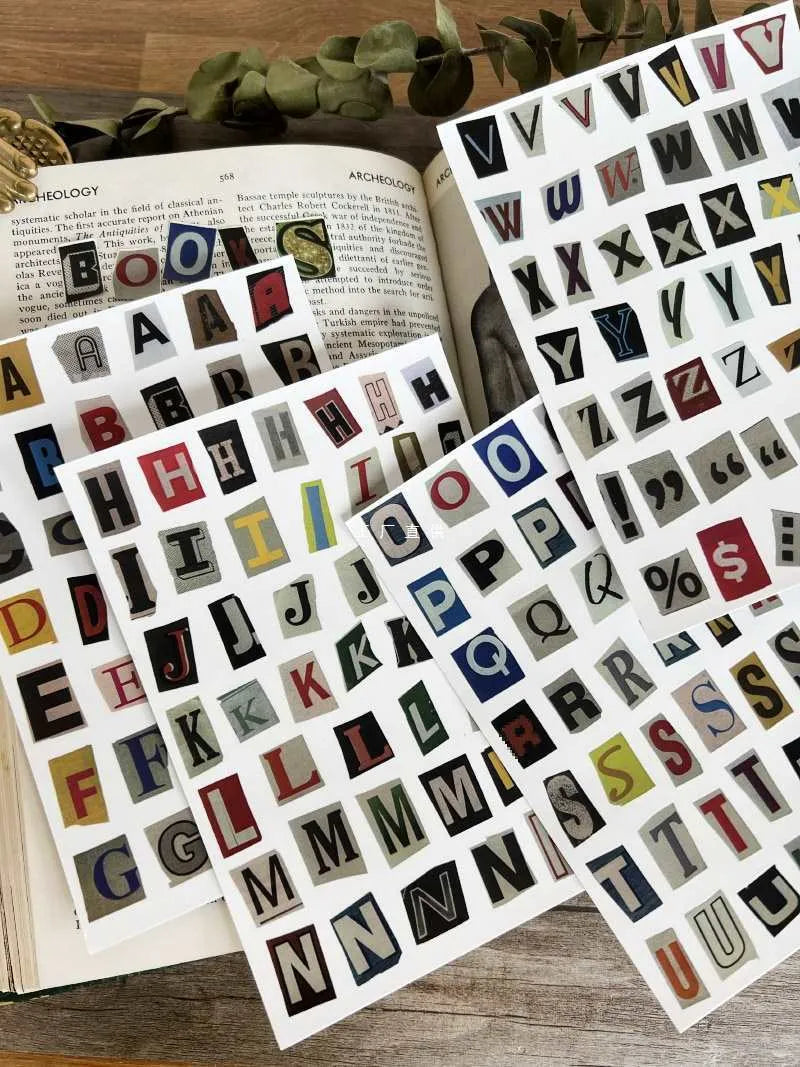 Pack of decorative stickers showing printed English alphabet letters and weekday words in a cute style for crafts.
