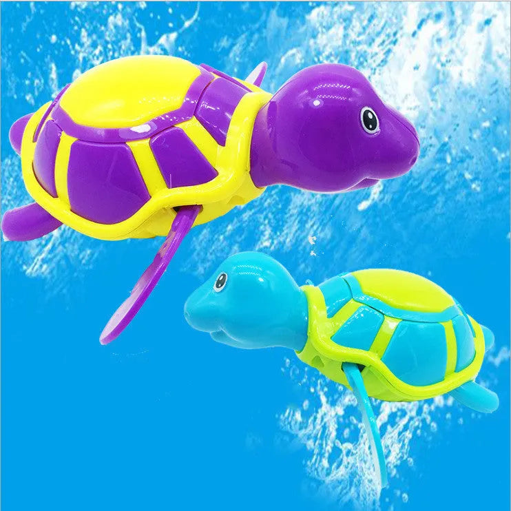Plastic baby tortoise bathroom toy floating in water, random colour, approximately 12 cm long