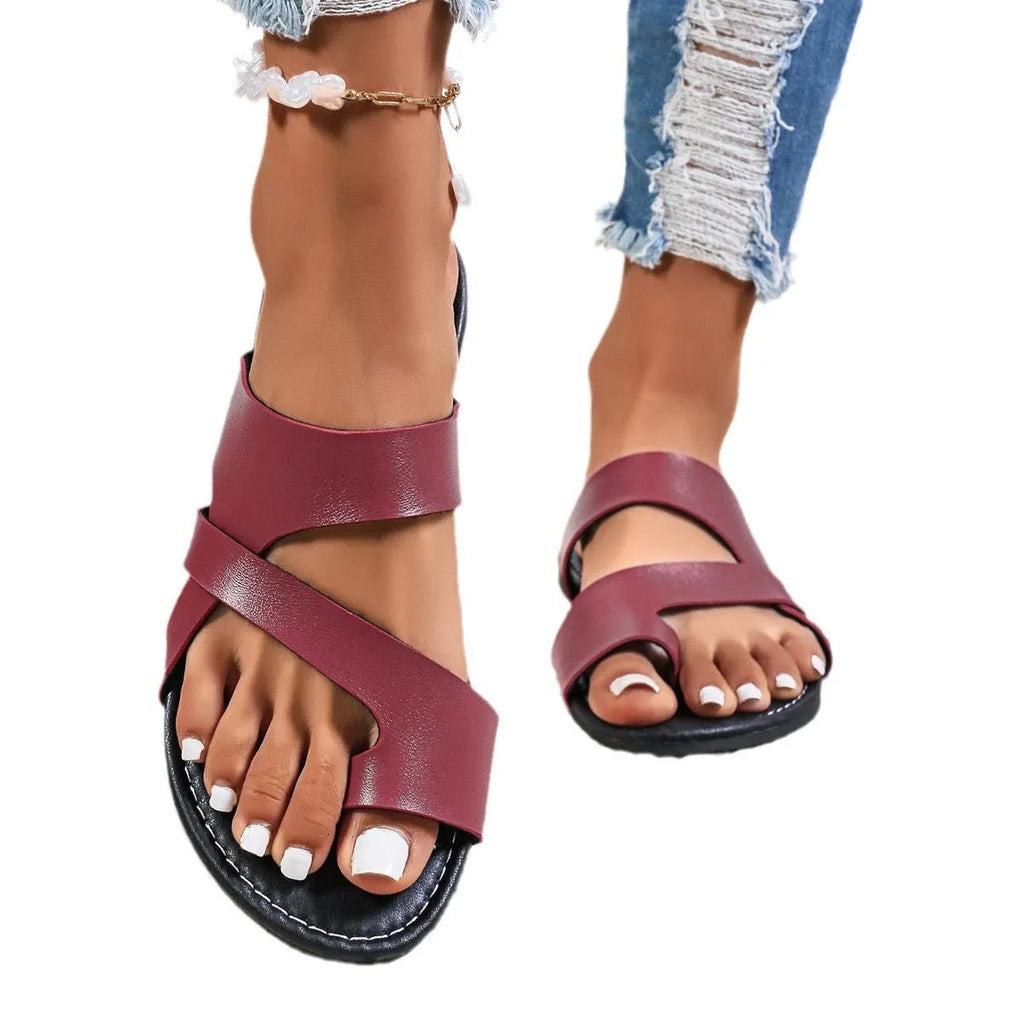 Men's casual beach slipper in wine red with hollow-out design and rubber sole.