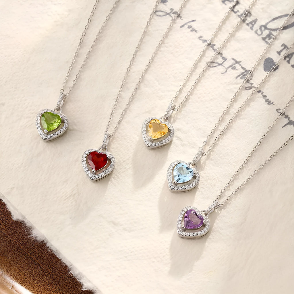 S925 sterling silver heart necklace with a natural gemstone on an adjustable cross chain for women.
