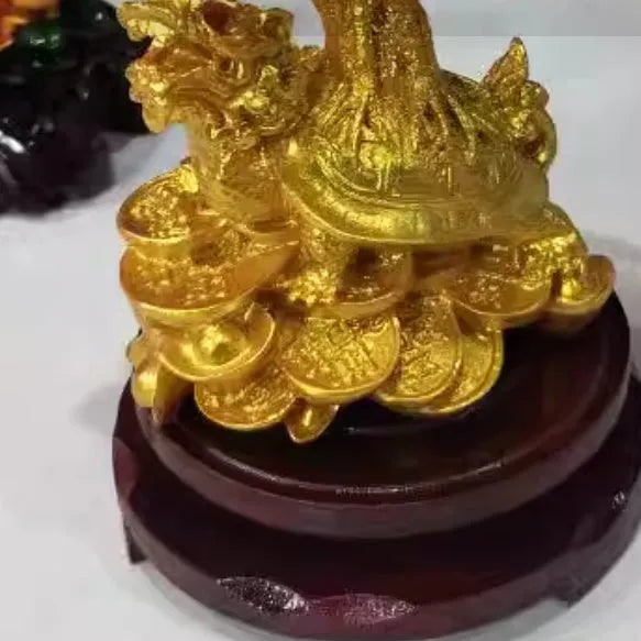 Citrine-coloured resin money tree Feng Shui ornament with a small water turtle design.