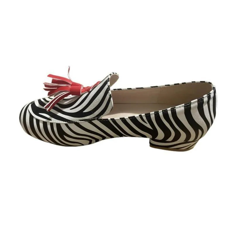 Women's leopard print tassel flat loafers with round toe artificial PU upper on light background