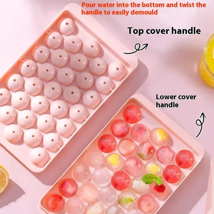 Blue flexible PE ice cube tray with lid, showing 33 round moulds, on a kitchen counter.