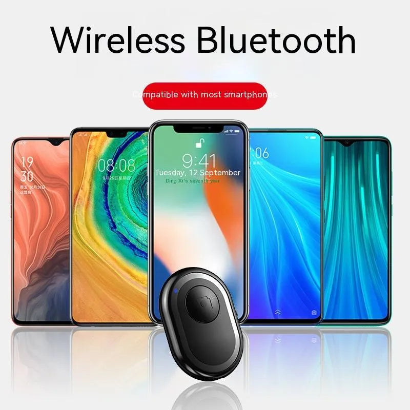 Wireless Bluetooth self-timer remote control in black, pink, and purple colours next to a smartphone.