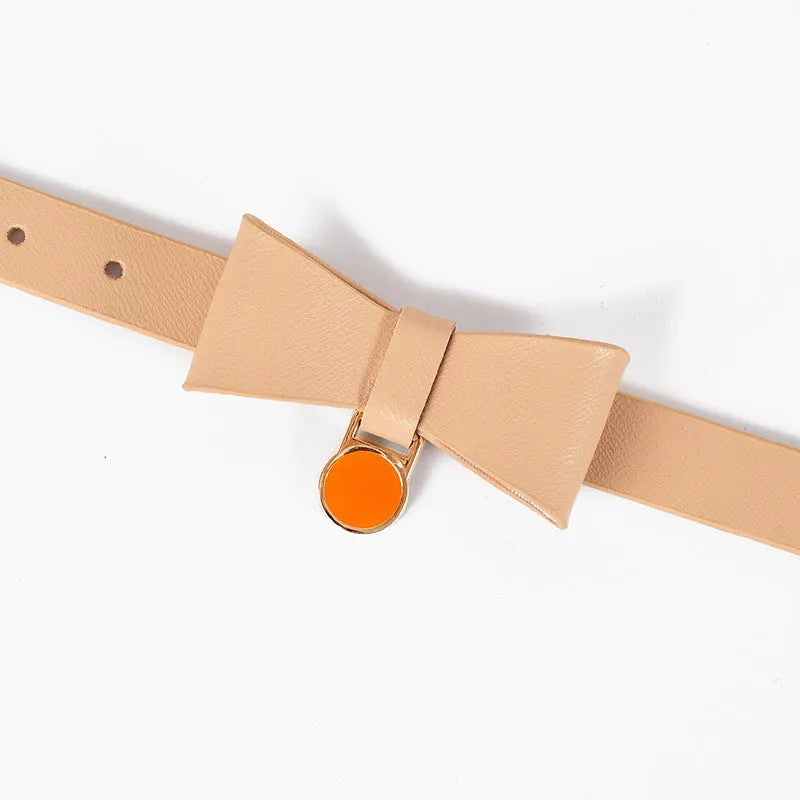 Brown leather cat collar with metal buckle adjustment on a grey background