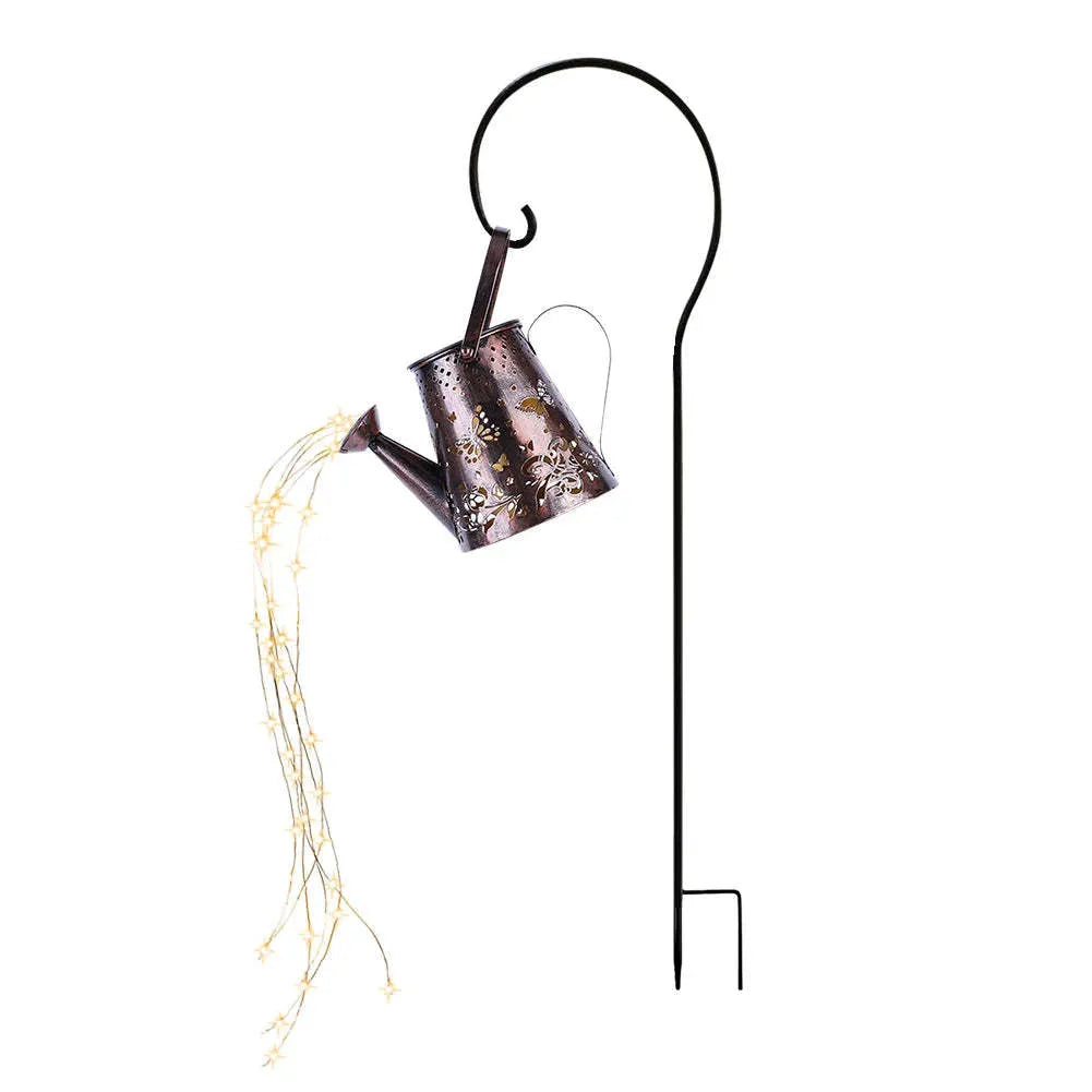 Solar-powered iron garden lamp with a tapered butterfly pattern emitting warm white light.